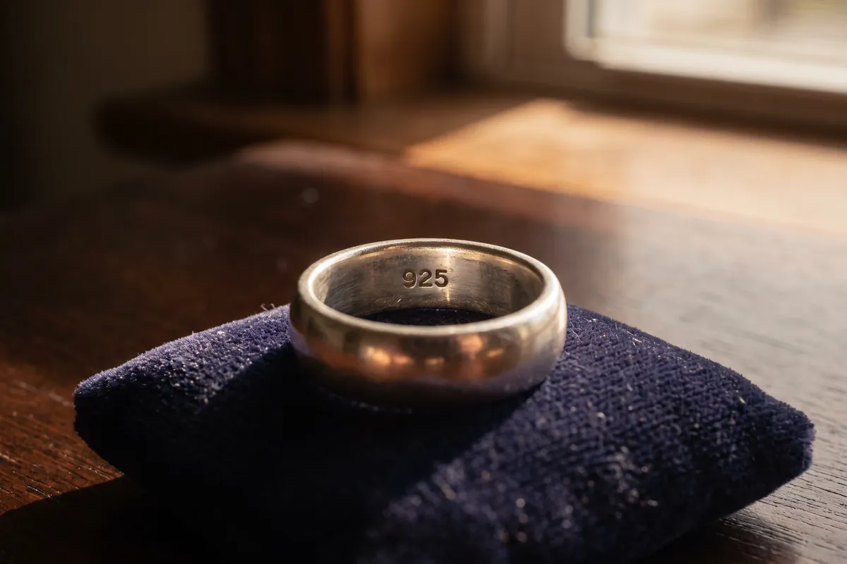 The number 925 stamped inside a sterling silver ring